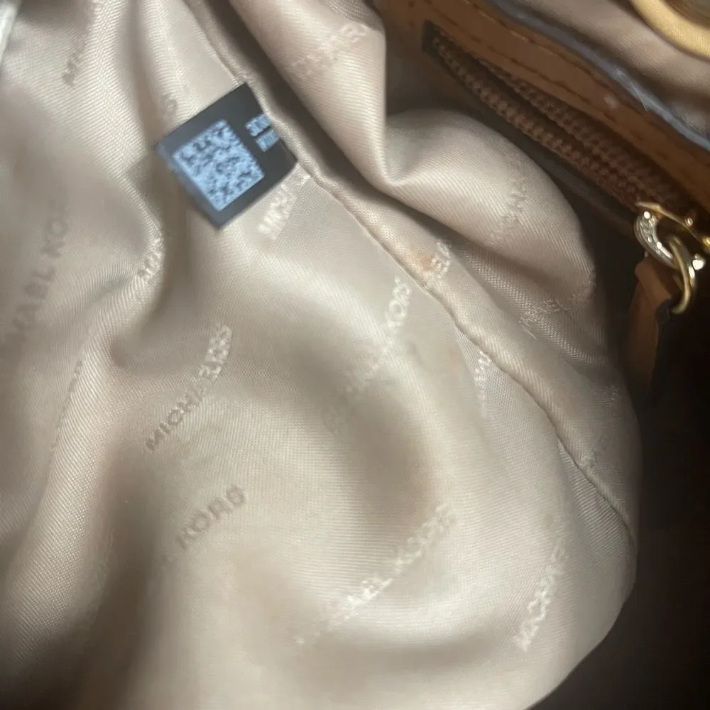 Michael Kors Beige signature Coated Canvas tote , tan leather straps .
